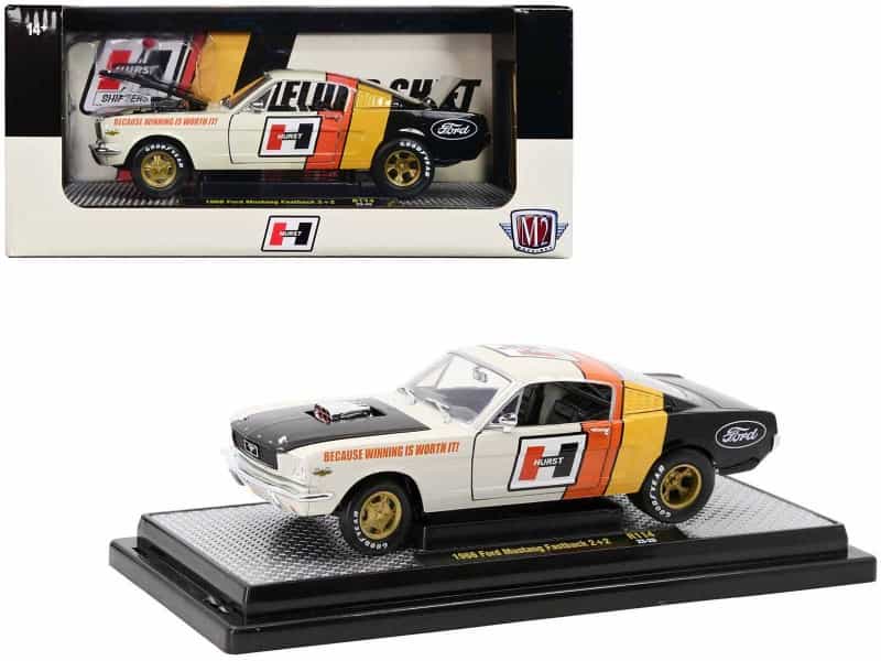 1966 Ford Mustang Fastback 2+2 Off White And Black With Red And Yellow Stripes "Hurst Shifters" Limited Edition To 6000 Pieces Worldwide 1/24 Diecast Model Car By M2 Machines